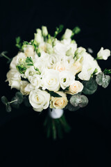 Wedding flowers, bridal bouquet close-up. Decoration of roses, peonies and ornamental plants