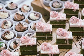 chocolate cakes on wooden plate in wedding party reception