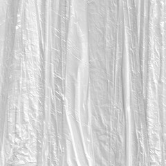 White crumpled plastic packing texture background