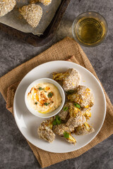 Vegan roasted wings, made with cauliflower, chickpea flour and gluten free bread