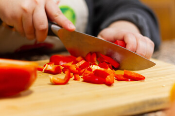 Girl cutting a pepper