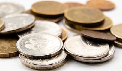 metal, round gray and gold coins in close-up. russian ruble