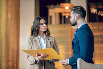 Business partners discussing the project and looking concentrated