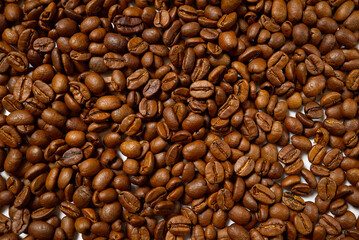 Arabica coffee beans fresh roasted. Coffee abstract backgroung.