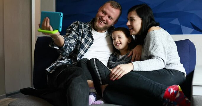 Family Makes Virtual Visit To Relatives During Video Call By Tablet During The Coronavirus Pandemic.