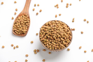 Dried chickpeas in bowl isolated on white background.