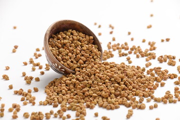Dried chickpeas in bowl isolated on white background.
