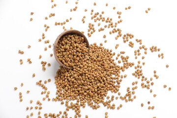 Dried chickpeas in bowl isolated on white background.