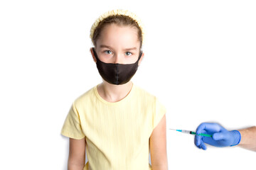 A nurse is giving vaccinations to patients with a syringe. A doctor vaccinates a teenage girl in a...