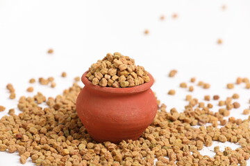 Dried chickpeas in bowl isolated on white background.