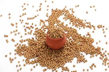Dried chickpeas in bowl isolated on white background.