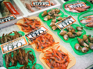 Japan local Seafood market Shrimp and shell in a basket with a price tag