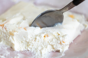 rustic breakfast: cottage cheese with dried apricots close-up