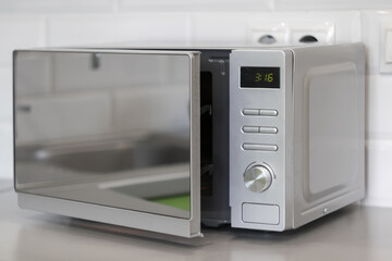 stylish microwave in the white kitchen close-up