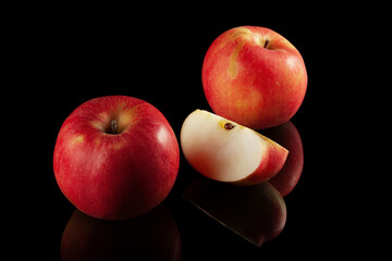 Red apples on a black background
