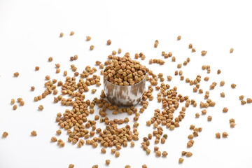 Dried chickpeas in bowl isolated on white background.