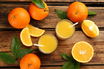 Orange juice and fresh fruits on wooden table, flat lay