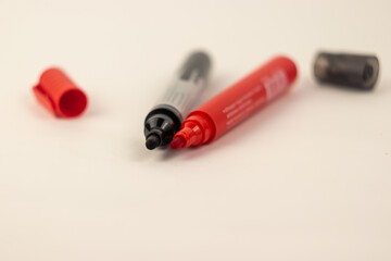 red and black markers close up