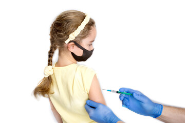 A nurse is giving vaccinations to patients with a syringe. A doctor vaccinates a teenage girl in a...