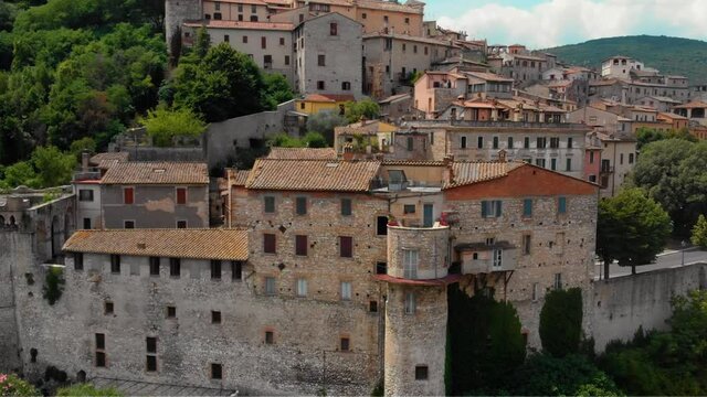 Aerial view of Narni (Terni, Umbria, Italy), medieval city with a rich history. Houses made of stone on top of the mountain. Incredible views. Summer day. Europe travel and vacation concept