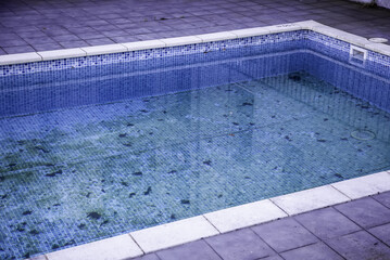 Dirty and abandoned swimming pool