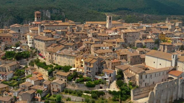 Aerial view of Narni (Terni, Umbria, Italy), medieval city with a rich history. Houses made of stone on top of the mountain. Incredible views. Summer day. Europe travel and vacation concept