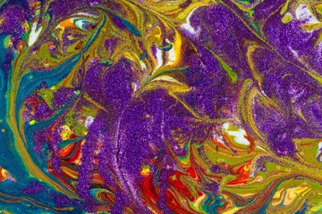 Multicolored acrylic backdrop sprinkled with purple sequins. Contemporary creativity. Colorful avant-garde texture. 