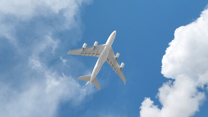 Passenger commercial airplane flying above head as shot from the ground in deep blue cloudy sky