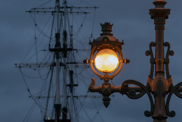 Fototapeta na wymiar Retro style lantern on The Trinity Bridge in Saint-Petersburg. Russia