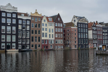 Amsterdam canal houses and their reflections in the water