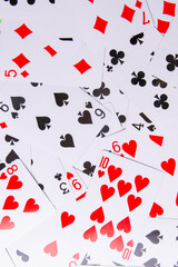 Playing cards on a green background. From above. low cards