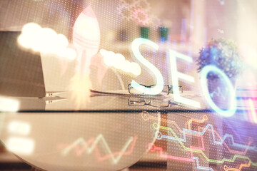 Double exposure of SEO drawing and office interior background. Concept of Search optimization...