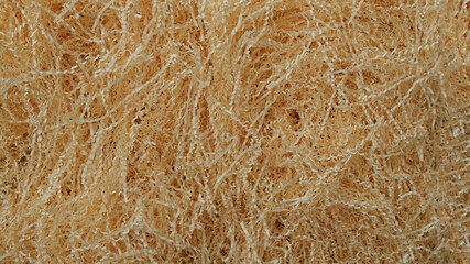 Shredded paper texture, filling for gift box, stuffing and shipping. Brown decorative straws fillers for your product placement. Centre composition with empty space for produce. Paper trash texture.
