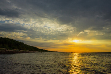 Obraz premium wide landscape with river bank at sunset