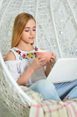 beautiful cute girl using laptop at home