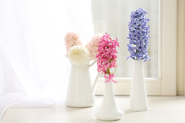 Beautiful fresh hyacinths on window sill indoors. Spring flowers