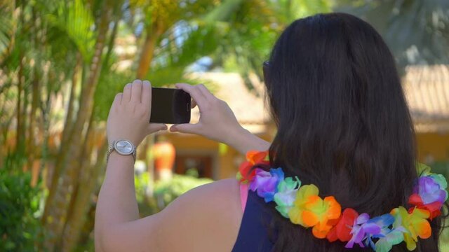 Woman taking picture in Hawaii in slow motion 180fps