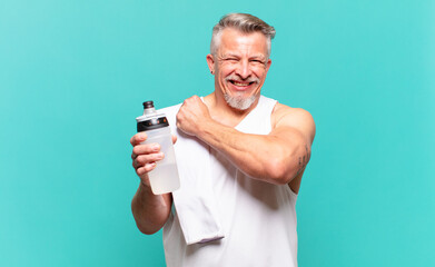 senior athlete man feeling happy, positive and successful, motivated when facing a challenge or celebrating good results