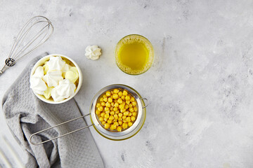 Chickpea brine, aquafaba and prepared meringue. Egg replacement for vegan recipe. Healthy vegan product. Top view. Copy space. 