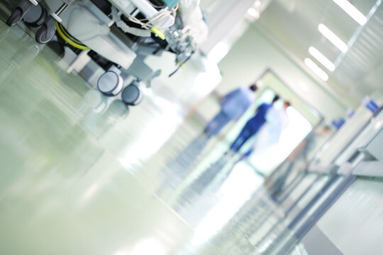 Medical staff walking down the hospital hallway