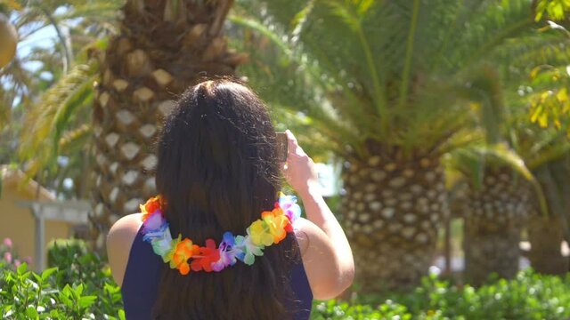 Woman taking picture in Hawaii in slow motion 180fps
