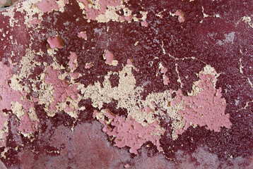 Old plaster wall with peeling paint