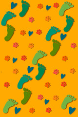 seamless pattern with pet and person footprint, heart and yellow background in vertical