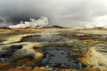 Valley with geothermal springs and geysers. Fantastic view of the hills and the current hot springs. Geothermal zones a Naumafjal Hverir in the north-eastern part of Iceland.
