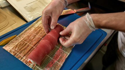 Chef cooking the national Japanese dish of sushi