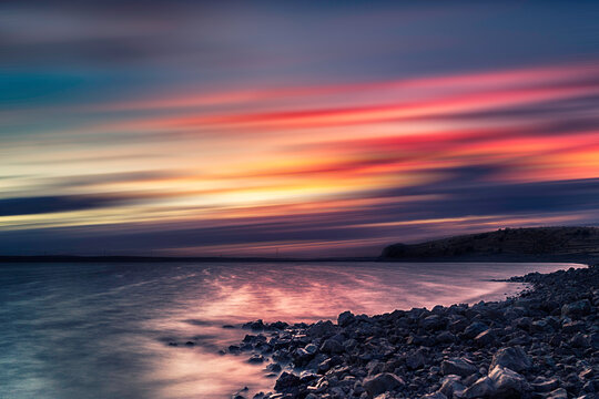 Sunset by a river. Long-exposure photography