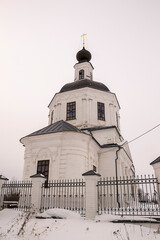 orthodox church made of white brick in winter