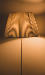 floor lamp with warm light and reflection in the window