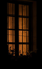 warm light from window at night.