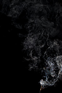 Jet Of Gray Smoke On A Black Background